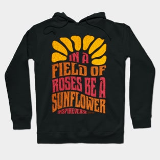 In a field of roses be a sunflower Hoodie